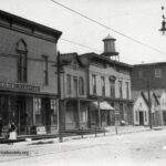 The south side of Main Street looking west from near the intersection of Erie Street.