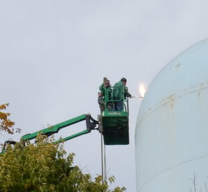 Torches are used to cut the tank into sections for removal.
