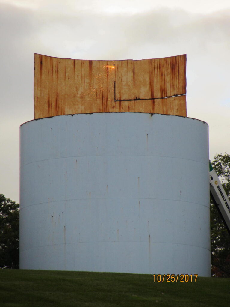 view of a section of the water tank being cut.